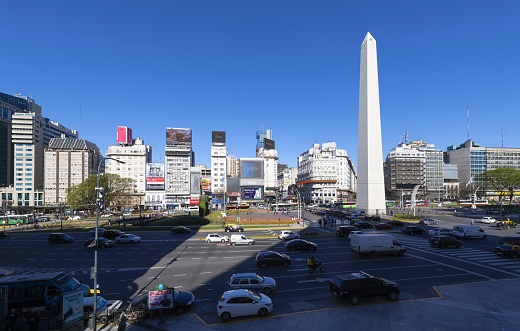 Buenos Aires, Argentina, October 31, 2019: View of the July 9 Avenue with the Obelisco de Buenos Aires, a national historic monument and icon of the city. It was erected in 1936 to commemorate the quadricentennial of the first foundation of the city.