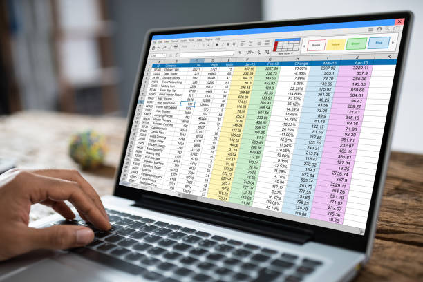 istock Cropped Image Of Businessman Using Laptop At Desk 1335446576