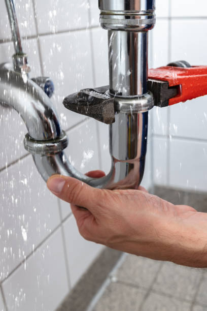 istock Plumber Repairing Sink Pipe Leakage 1335446678