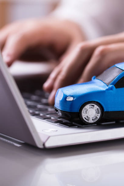 istock Blue Car On Laptop Keypad 1335446683