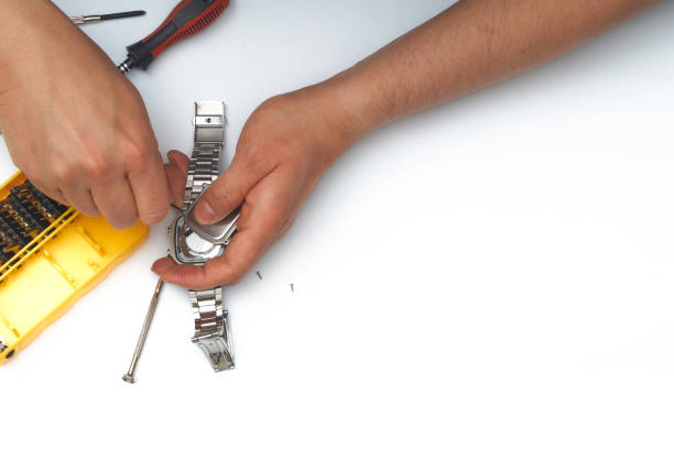 istock watchmaker opening a wrist watch 1335453156
