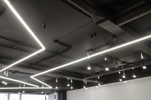Ceiling ventilation ducts and ceiling LED lights. Engineering air system.