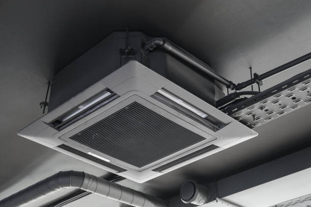 istock Cassette split system on gray ceiling. Indoor unit of air conditioner. 1335462108