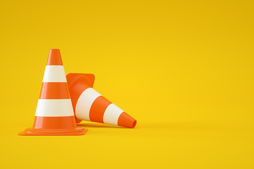 3d rendering of Traffic Cones on Yellow Background.