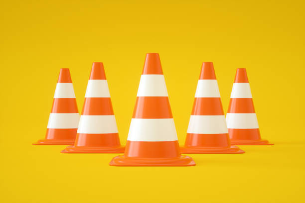 istock Traffic Cones on Yellow Background 1335465574
