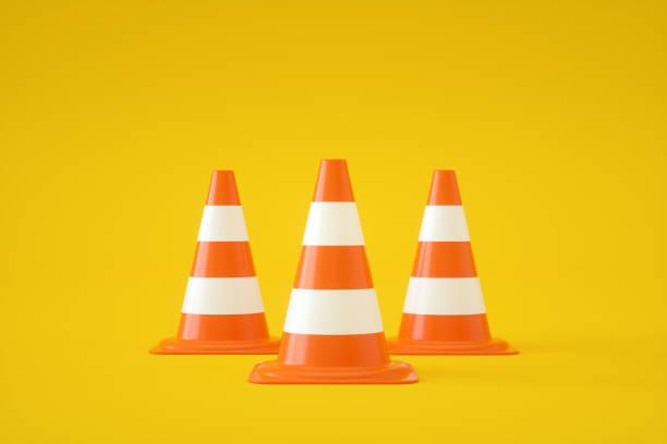 istock Traffic Cones on Yellow Background 1335465603