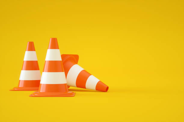 istock Traffic Cones on Yellow Background 1335465624