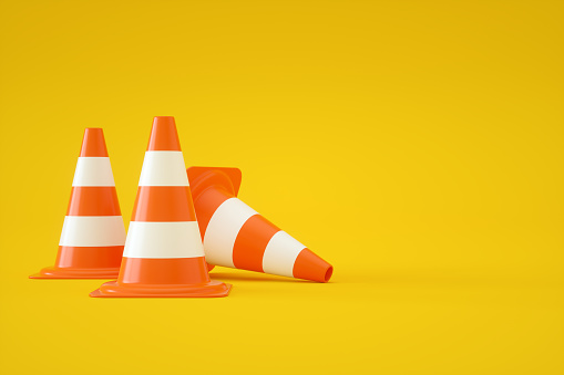 3d rendering of Traffic Cones on Yellow Background.