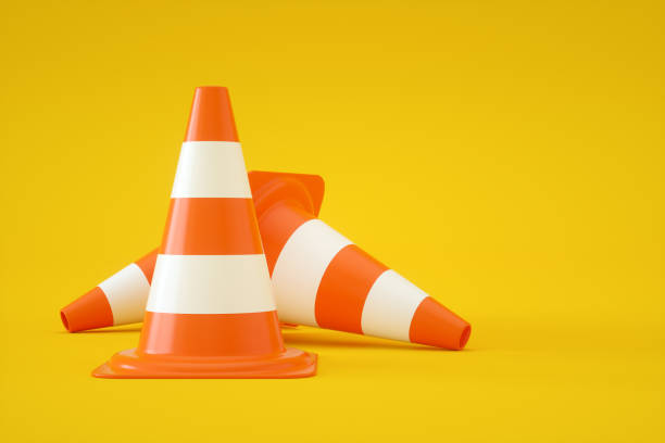 istock Traffic Cones on Yellow Background 1335465640
