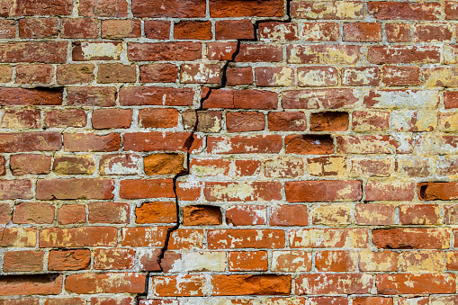 Old brick wall with the big crack