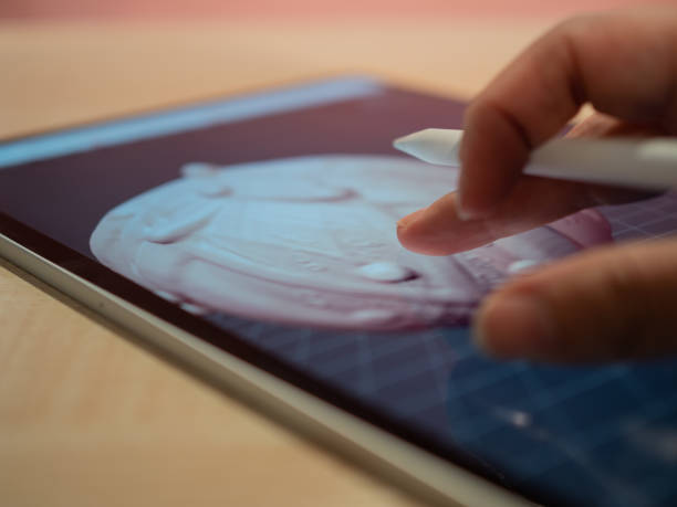 istock 3D modeling in a mobile application, the author's hand creates a model 1335466836