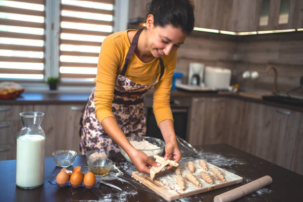 istock Woman kneading pastries at home in the kitchen 1335468452
