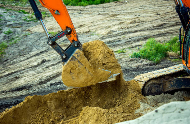 istock Closeup bucket of backhoe digging the soil at construction site. Crawler excavator digging on demolition site. Excavating machine. Earth moving equipment. Excavation vehicle. 1335472142