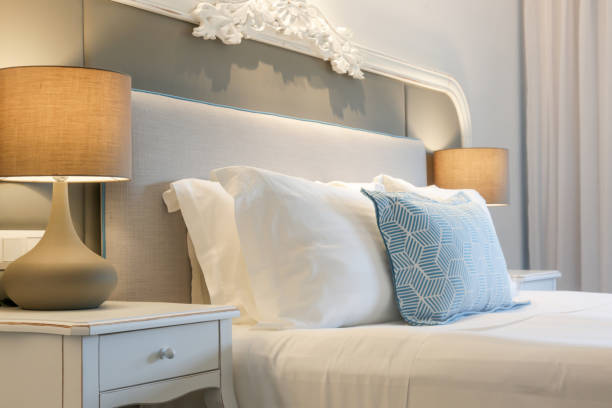 istock Cozy and elegant bedroom. King size bed with bedside lamp. 1335473597