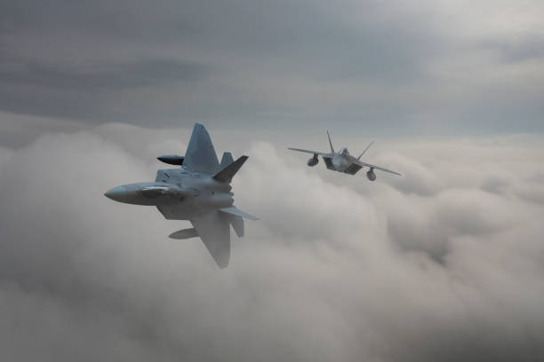 istock Jet fighters flying over the clouds. 1335475452