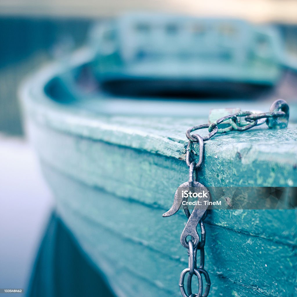 Wooden boat is waiting Chained wooden boat is waiting for sunday passengers. Focus is on the hook and the boat in background is blurry. Beauty In Nature Stock Photo