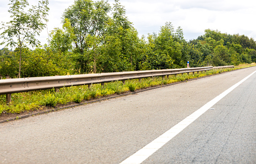 A British road hard shoulder seen from the driver or passenger view. This 'lane' used for vehicles that have an emergency or have broken down to keep them safe.