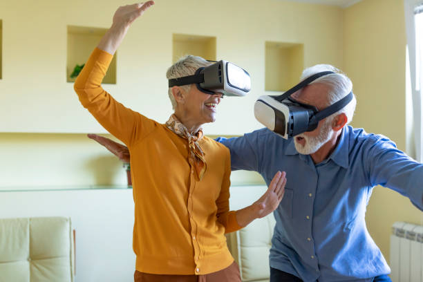 istock A Couple of Retirees is Gesturing and Smiling While Playing a Games on VR System. 1335487924