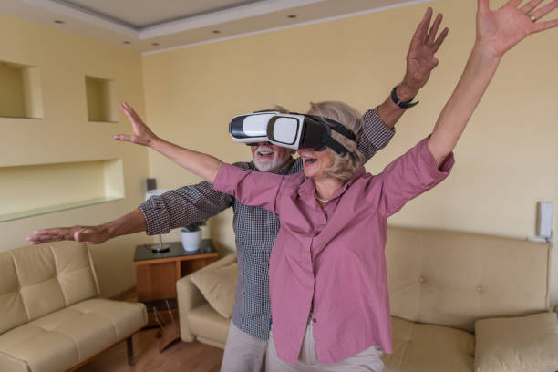 istock Mature Couple Playing Virtual Reality Games 1335488060