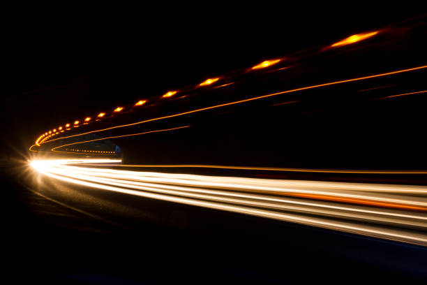 istock Car light trails on the road 1335489577