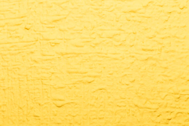 istock Rough yellow wall texture background to edit, insert text or images. Design work 1335494991