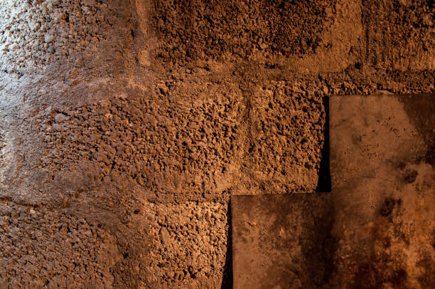 istock Stone wall dark background with light. Grunge style wall for background 1335502870