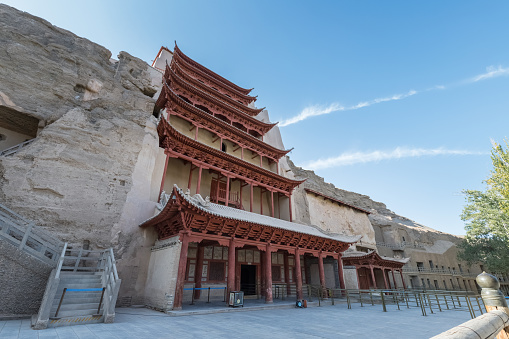 Nine floors against a blue sky, Mogao Grottoes landmark scenery, famous tourist destination on the silk road, Dunhuang city, Gansu province, China.\