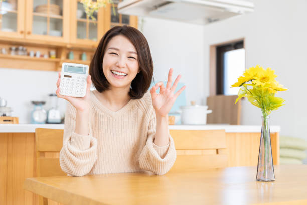 Woman having an electronic calculator stock photo