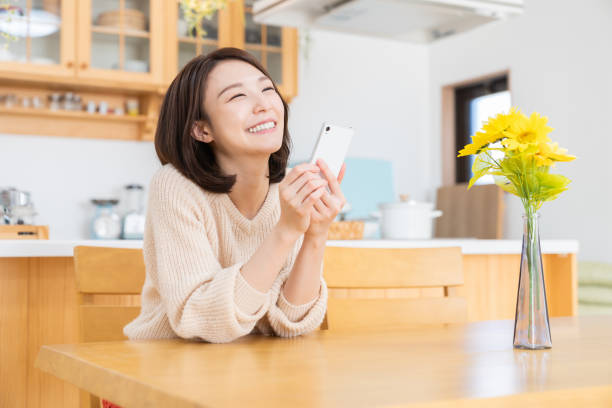 attractive asian woman to see a smart phone