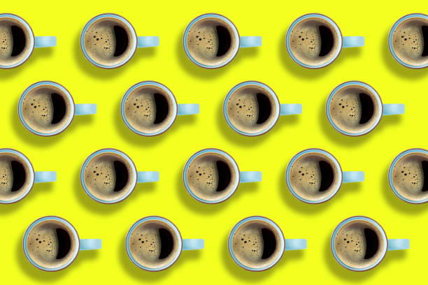 istock Coffee cups on bright yellow background. 1335513043