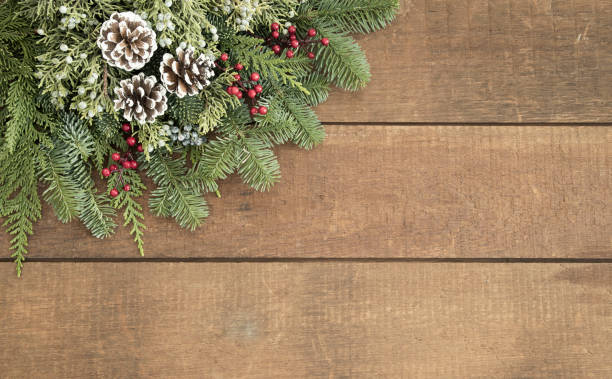 istock Christmas wreath on an old wood background 1335515392