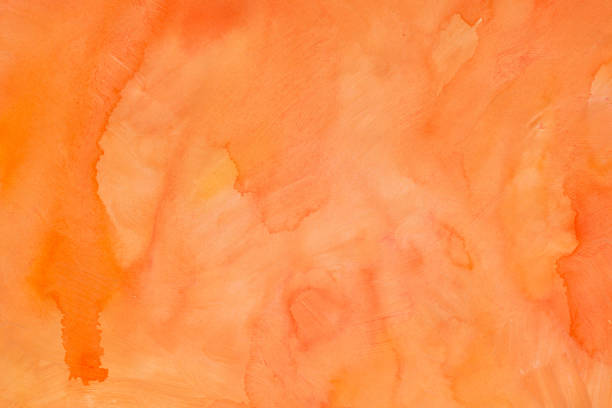 orange watercolor painted background texture stock photo