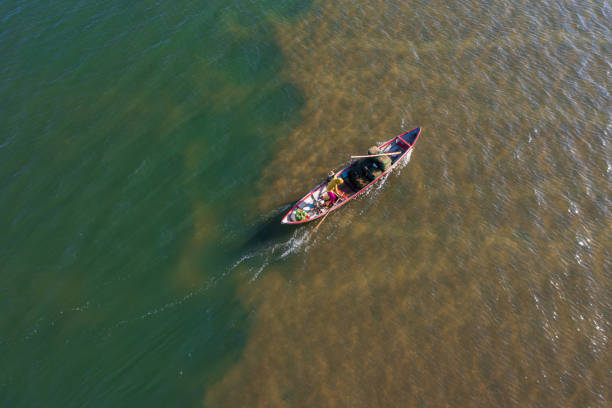 istock Putting fishing trap on Tra Khuc river 1335518893