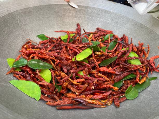 istock Chili and kaffir lime leaves roasting. 1335519722