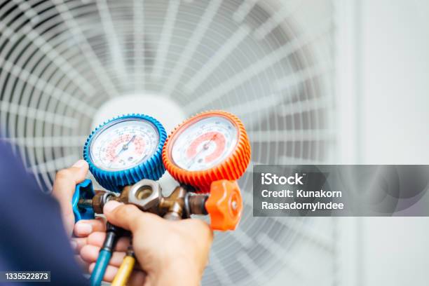 Air Conditioning Technician And A Part Of Preparing To Install New Air Conditioner Stock Photo - Download Image Now