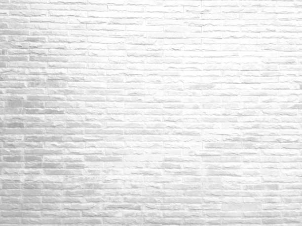 istock Rough white stone wall background in vintage style for graphic design 1335528715