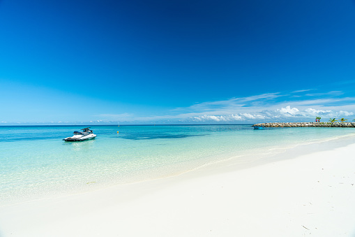 Beautiful white sand beach and blue sky in Maafushi Island, Maldives.