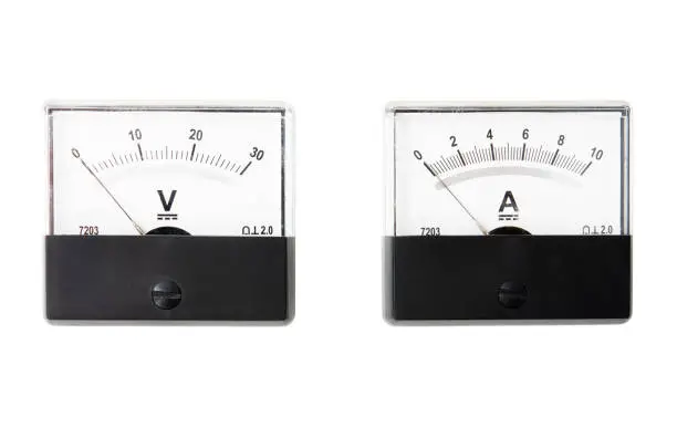 Photo of Analogue ammeter and voltmeter isolated on white background.