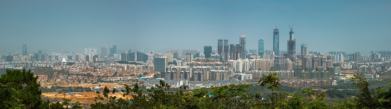 Panoramic view of ASEAN Business District and city center from the top of Qingxiu Mountain Scenic Spot Zone ( 青秀山风景区) in Nanning, Guangxi Zhuang Autonomous Region, China. Featuring Guangxi China Resources Tower, Nanning Logan Century 1, ASEAN Expo Center, etc.