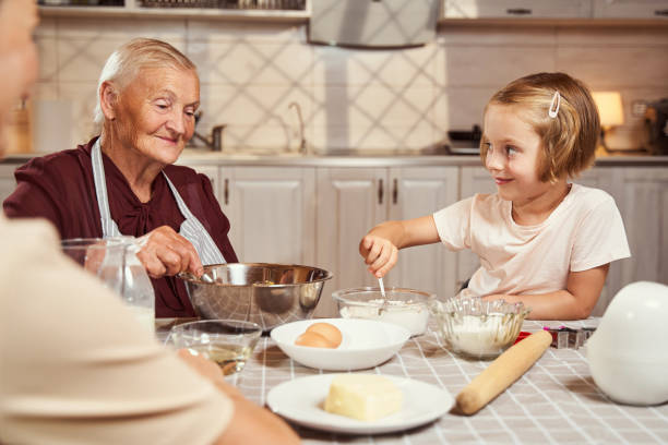 istock Child scooping up spoon of flour from glass dish 1335538174