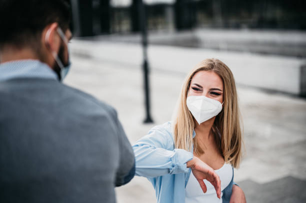 istock Colleagues in the office practicing alternative greeting for safety and protection during COVID-19 stock photo 1335539177