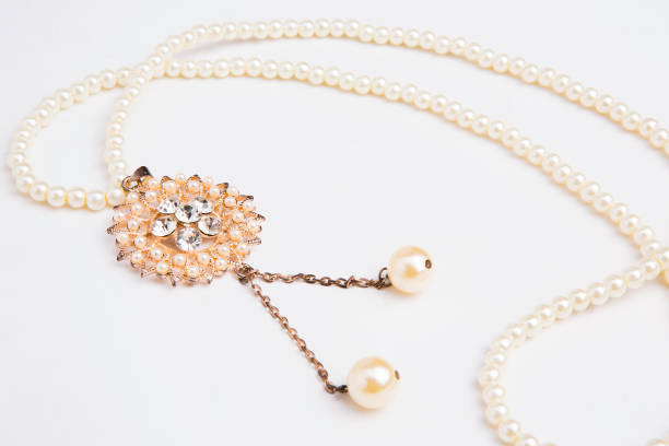 istock Pearls necklace on white background 1335541501