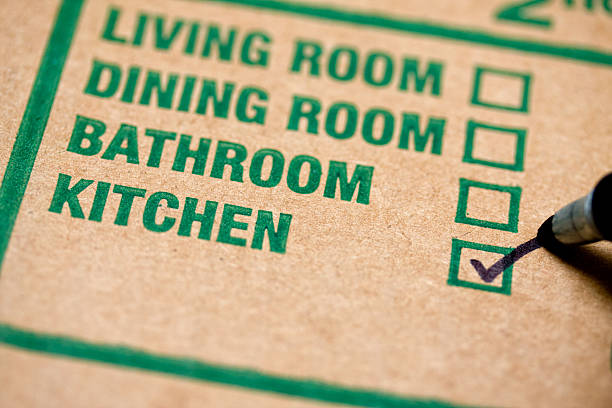 Moving box Moving box with checkmark on kitchen labeling stock pictures, royalty-free photos & images