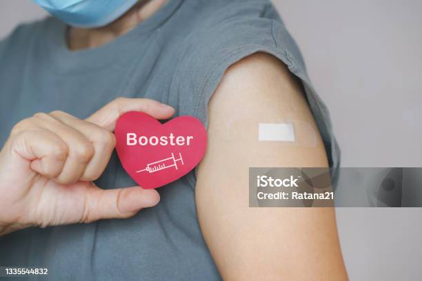 Senior Woman Show Red Heart Shape With Syringe Icon After Vaccinated Or Inoculation Booster Dose Due To Spread Of Corona Virus Population Social Or Herd Immunity Concept Stock Photo - Download Image Now