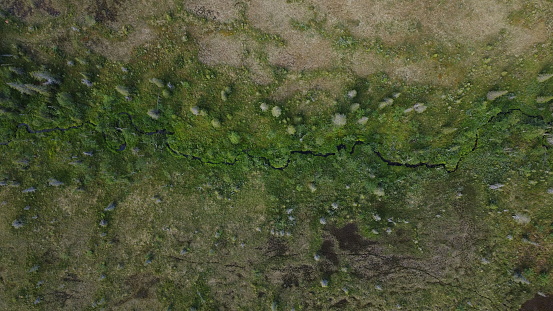 River flowing through Arctic tundra from above