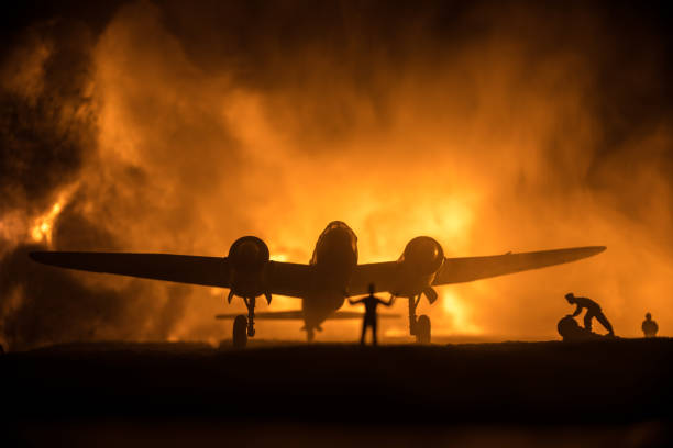 istock German Junker (Ju-88) night bomber at night. Artwork decoration with scale model of jet-propelled plane in possession. Toned foggy background with light. War scene. 1335552290