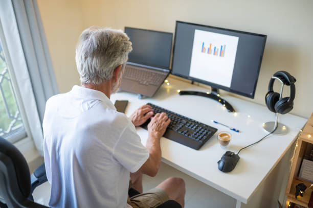 istock Senior man working from home on a remote job in a home office 1335555628