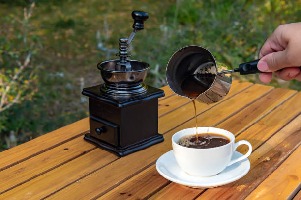 istock Fresh coffee from a cezve pouring in cup 1335557234