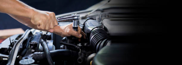 istock Car mechanic working on car engine, car maintenance concept. 1335560760