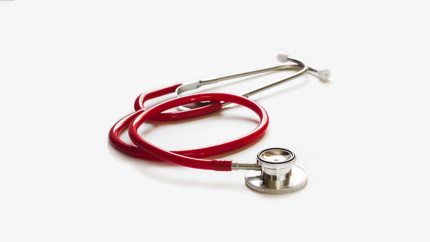 istock red stethoscope on gray background ,health care concept. 1335561378